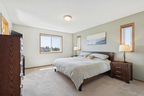 16 Henderson Bay Ne, Langdon, AB - Indoor Photo Showing Bedroom