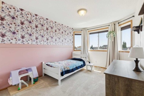 16 Henderson Bay Ne, Langdon, AB - Indoor Photo Showing Bedroom