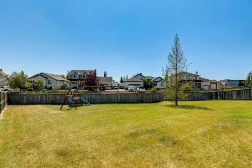 16 Henderson Bay Ne, Langdon, AB - Outdoor With Backyard