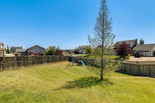 16 Henderson Bay Ne, Langdon, AB - Outdoor With Backyard
