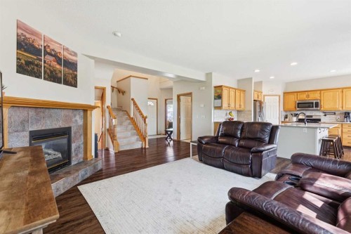 16 Henderson Bay Ne, Langdon, AB - Indoor Photo Showing Living Room With Fireplace