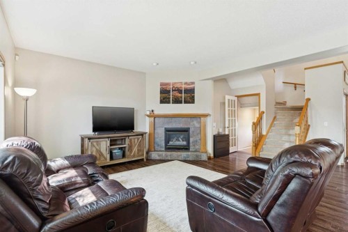 16 Henderson Bay Ne, Langdon, AB - Indoor Photo Showing Living Room With Fireplace