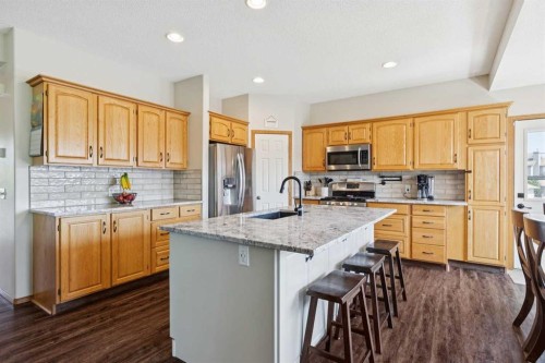 16 Henderson Bay Ne, Langdon, AB - Indoor Photo Showing Kitchen With Stainless Steel Kitchen With Upgraded Kitchen