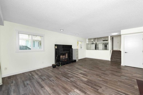 98 Del Ray Road Ne, Calgary, AB - Indoor Photo Showing Living Room With Fireplace