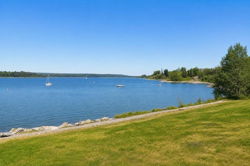 87 Couture Crescent Sw, Calgary, AB - Outdoor With Body Of Water With View