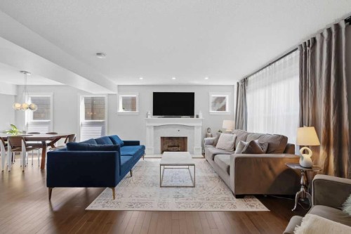 87 Couture Crescent Sw, Calgary, AB - Indoor Photo Showing Living Room With Fireplace