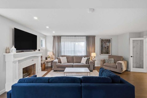 87 Couture Crescent Sw, Calgary, AB - Indoor Photo Showing Living Room With Fireplace