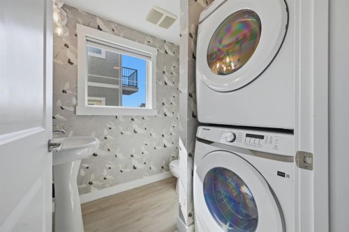 128 West Springs Road Sw, Calgary, AB - Indoor Photo Showing Laundry Room
