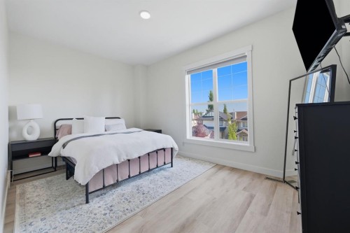 128 West Springs Road Sw, Calgary, AB - Indoor Photo Showing Bedroom