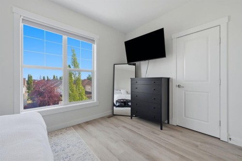 128 West Springs Road Sw, Calgary, AB - Indoor Photo Showing Bedroom