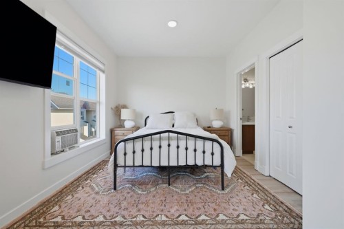 128 West Springs Road Sw, Calgary, AB - Indoor Photo Showing Bedroom