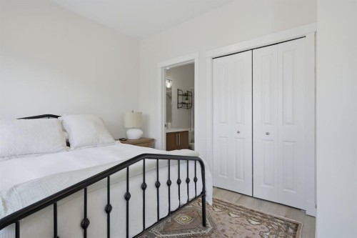 128 West Springs Road Sw, Calgary, AB - Indoor Photo Showing Bedroom