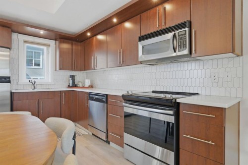 128 West Springs Road Sw, Calgary, AB - Indoor Photo Showing Kitchen With Stainless Steel Kitchen