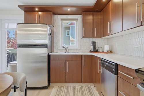 128 West Springs Road Sw, Calgary, AB - Indoor Photo Showing Kitchen With Stainless Steel Kitchen With Double Sink