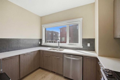 904-218 Sherwood Square Nw, Calgary, AB - Indoor Photo Showing Kitchen With Double Sink