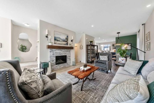 114 Seton Grove Se, Calgary, AB - Indoor Photo Showing Living Room With Fireplace