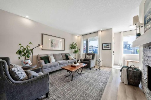 114 Seton Grove Se, Calgary, AB - Indoor Photo Showing Living Room With Fireplace