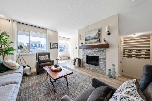 114 Seton Grove Se, Calgary, AB - Indoor Photo Showing Living Room With Fireplace
