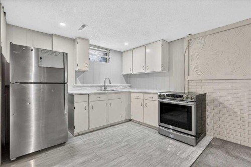 136 Templeview Place Ne, Calgary, AB - Indoor Photo Showing Kitchen With Double Sink