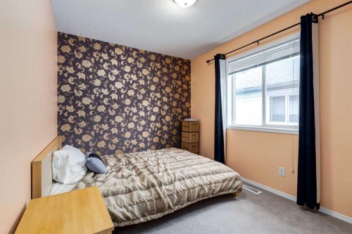 156 Tuscany Meadows Close Nw, Calgary, AB - Indoor Photo Showing Bedroom