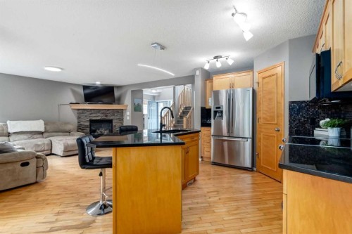 156 Tuscany Meadows Close Nw, Calgary, AB - Indoor With Fireplace