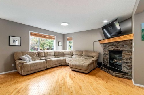 156 Tuscany Meadows Close Nw, Calgary, AB - Indoor Photo Showing Living Room With Fireplace