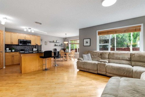 156 Tuscany Meadows Close Nw, Calgary, AB - Indoor Photo Showing Living Room