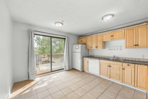 1 Edgewood Drive Nw, Calgary, AB - Indoor Photo Showing Kitchen With Double Sink