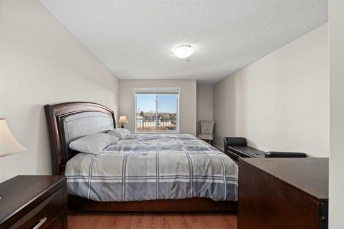 2321-700 Willowbrook Road Nw, Airdrie, AB - Indoor Photo Showing Bedroom