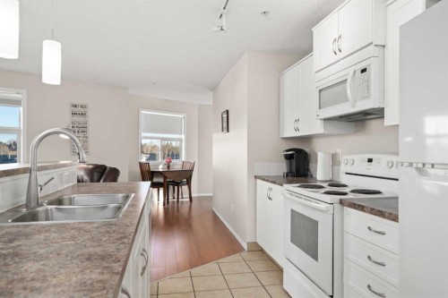 2321-700 Willowbrook Road Nw, Airdrie, AB - Indoor Photo Showing Kitchen With Double Sink
