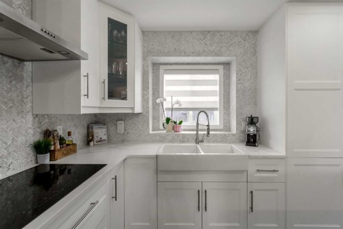 59 Rivercroft Close Se, Calgary, AB - Indoor Photo Showing Kitchen With Double Sink