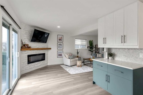 59 Rivercroft Close Se, Calgary, AB - Indoor Photo Showing Living Room With Fireplace
