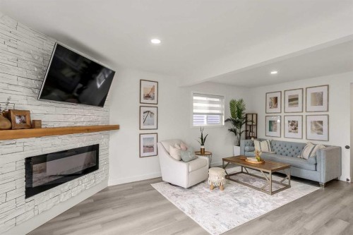 59 Rivercroft Close Se, Calgary, AB - Indoor Photo Showing Living Room With Fireplace