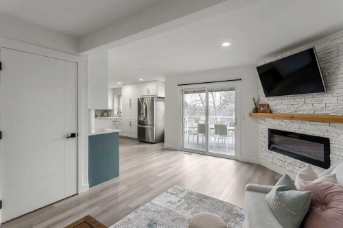 59 Rivercroft Close Se, Calgary, AB - Indoor Photo Showing Living Room With Fireplace