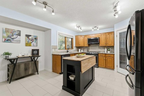 14125 Evergreen Street Sw, Calgary, AB - Indoor Photo Showing Kitchen With Stainless Steel Kitchen With Double Sink
