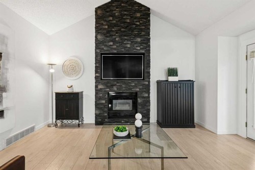14125 Evergreen Street Sw, Calgary, AB - Indoor Photo Showing Other Room With Fireplace