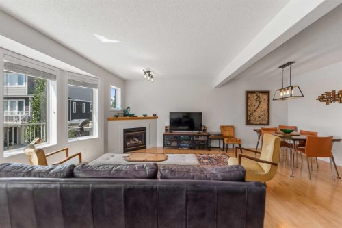 472 Regal Park Ne, Calgary, AB - Indoor Photo Showing Living Room With Fireplace