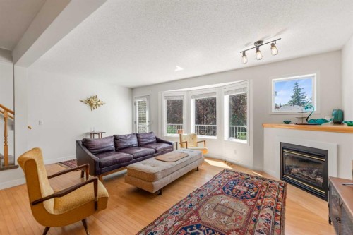 472 Regal Park Ne, Calgary, AB - Indoor Photo Showing Living Room With Fireplace