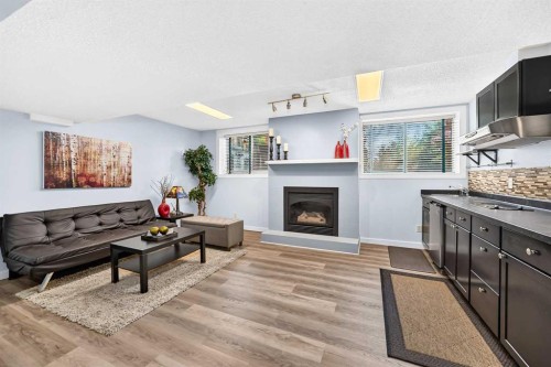 144 Riverstone Crescent Se, Calgary, AB - Indoor Photo Showing Living Room With Fireplace