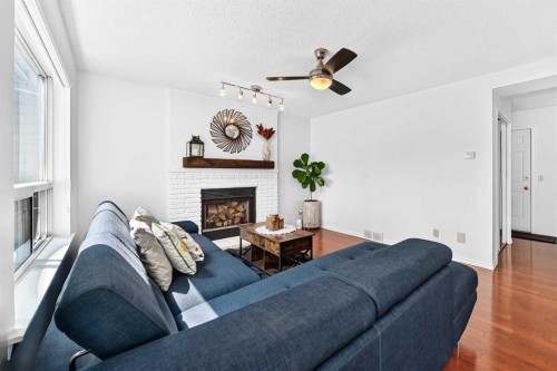 144 Riverstone Crescent Se, Calgary, AB - Indoor Photo Showing Living Room With Fireplace