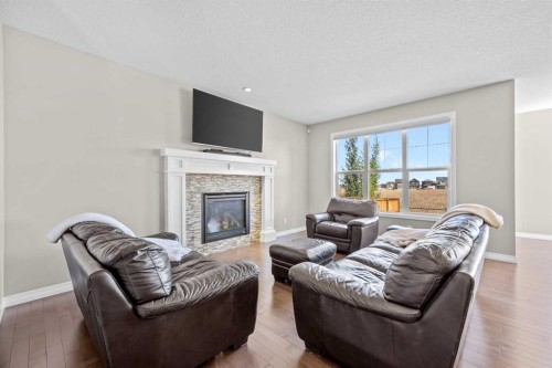 27 Mahogany Crescent Se, Calgary, AB - Indoor Photo Showing Living Room With Fireplace