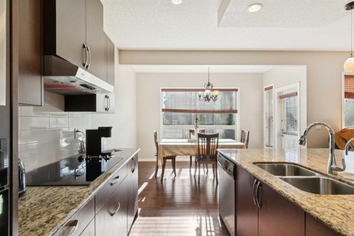 92 Cougar Ridge Close Sw, Calgary, AB - Indoor Photo Showing Kitchen With Double Sink With Upgraded Kitchen