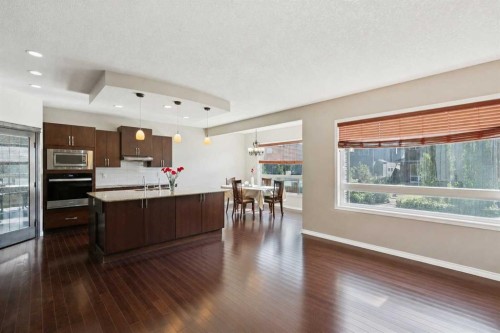 92 Cougar Ridge Close Sw, Calgary, AB - Indoor Photo Showing Living Room With Fireplace