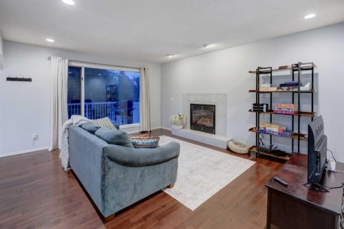 215 Arbour Ridge Way Nw, Calgary, AB - Indoor Photo Showing Living Room With Fireplace
