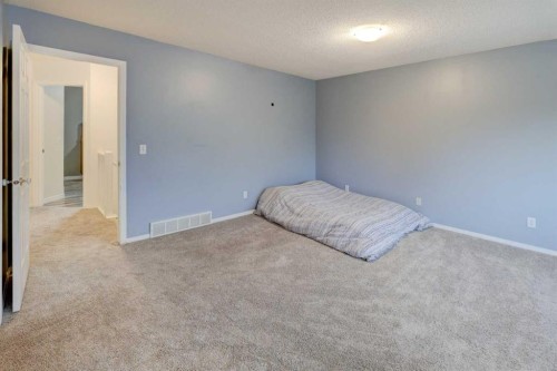 215 Arbour Ridge Way Nw, Calgary, AB - Indoor Photo Showing Bedroom
