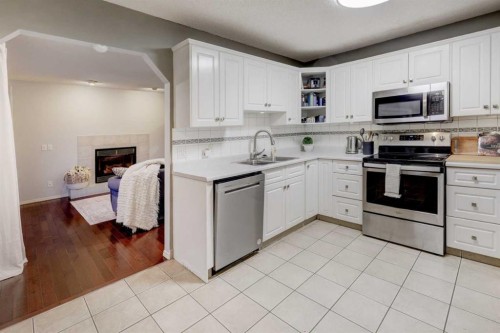 215 Arbour Ridge Way Nw, Calgary, AB - Indoor Photo Showing Kitchen With Double Sink
