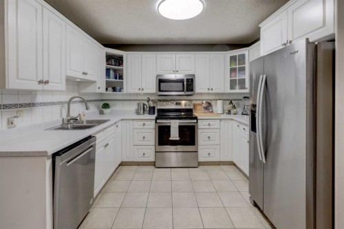 215 Arbour Ridge Way Nw, Calgary, AB - Indoor Photo Showing Kitchen With Double Sink