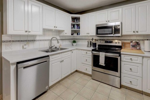 215 Arbour Ridge Way Nw, Calgary, AB - Indoor Photo Showing Kitchen With Double Sink