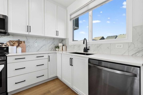 87 Heirloom Boulevard Se, Calgary, AB - Indoor Photo Showing Kitchen