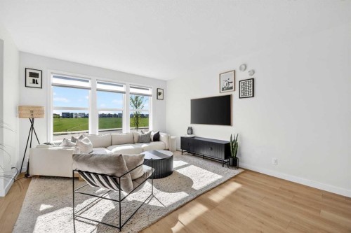 87 Heirloom Boulevard Se, Calgary, AB - Indoor Photo Showing Living Room